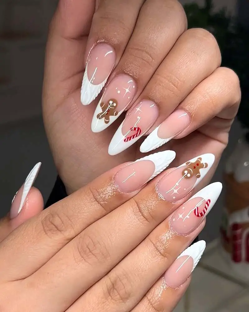 Nude and white Christmas nails with gingerbread men and candy cane designs