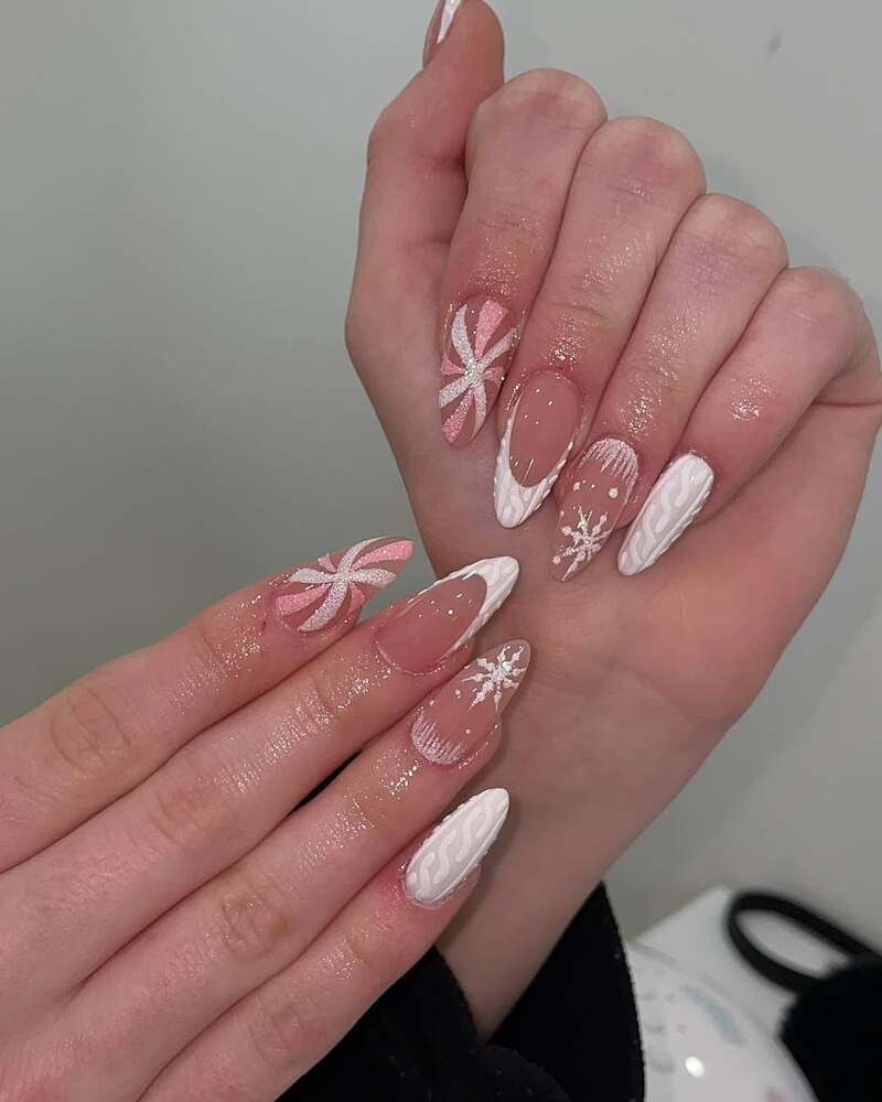 Nude and white winter nails with snowflakes and knit textures