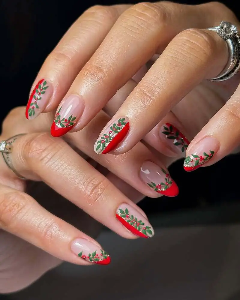 Nude and red nails with holly leaves and gold glitter accents