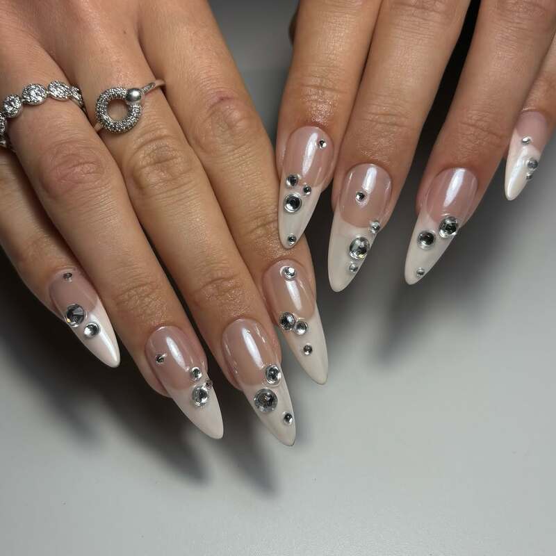 Nude ombre nails with crystal rhinestones in gradient pattern