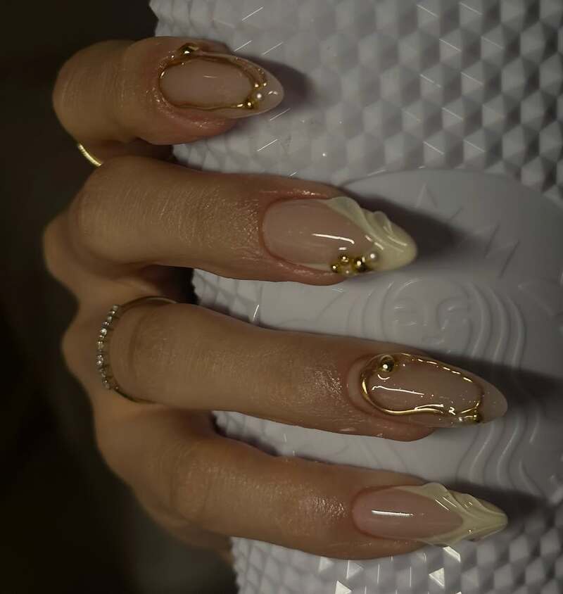 Nude nails with gold wire details and pearl embellishments